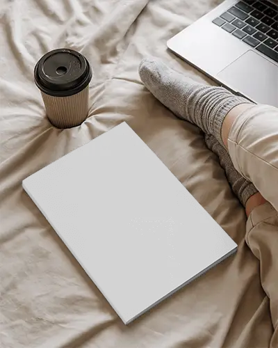 Cozy Home Office Setup With Magazine Mockup On Bed And Laptop For Design Display