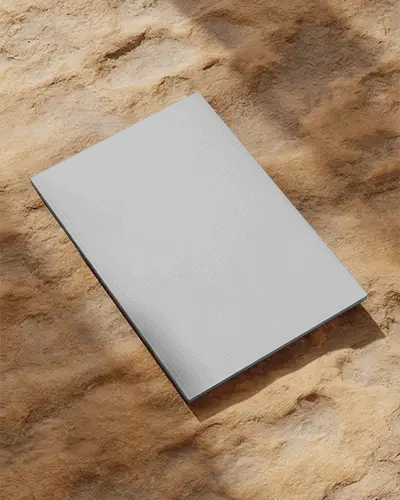 Premium Hardcover Magazine Mockup On Textured Ground Surface For Showcasing Designs