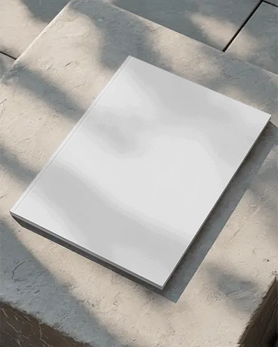 Realistic Magazine Mockup Placed On Rough Stone Block Highlighted By Soft Natural Light