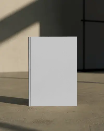 Stylish Hardcover Magazine Mockup Presented On Minimalist Concrete Surface With Natural Light