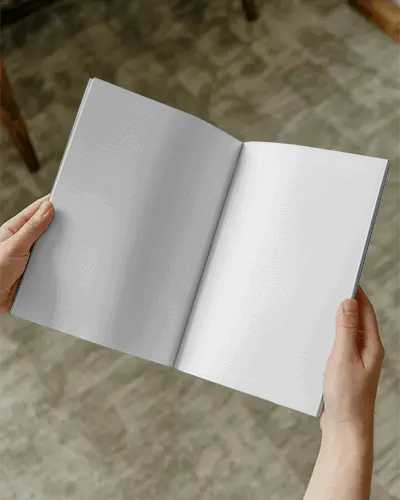 Hands Holding Open Magazine Mockup For Print Design Showcases Realistic Layout Example