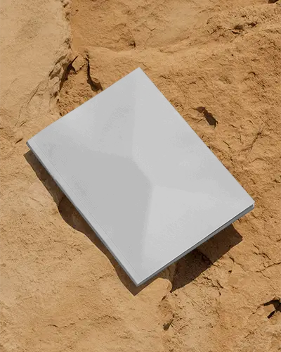 Hardcover Magazine Mockup Placed On Textured Sandy Surface Creative Product