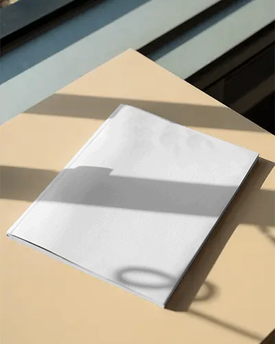 Hardcover Magazine Mockup On Minimalist Table With Natural Light And Shadow Effect