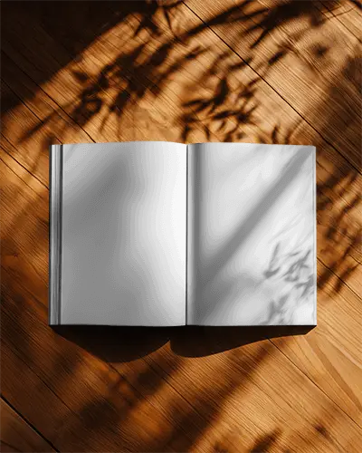 Open Magazine Mockup Showing Blank Pages On Sunlit Wood Floor Background
