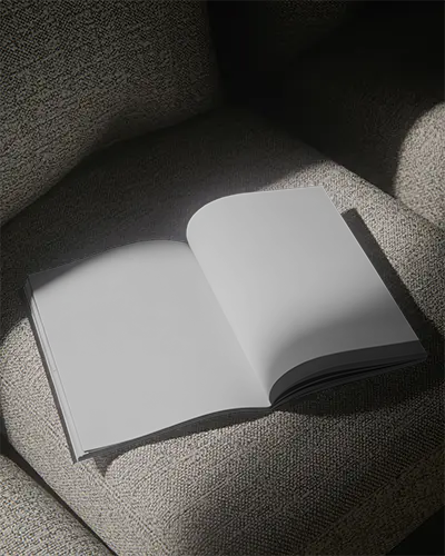 Open Magazine Mockup Displayed On Comfortable Upholstered Seat For Branding