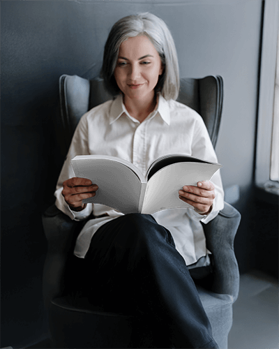 Cozy Reading Magazine Mockup Female Model In Soft Seating