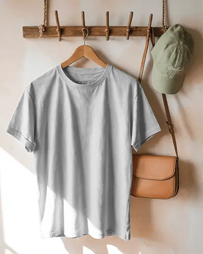 Sunlit Wall Hanging T Shirt Mockup Wooden Hook Backdrop With Minimal Accessories And Natural Light