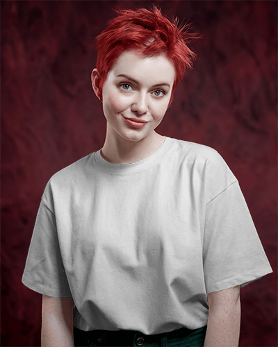 Vibrant Studio T Shirt Mockup Female Model With Red Hair Smiling In Warm Red Background