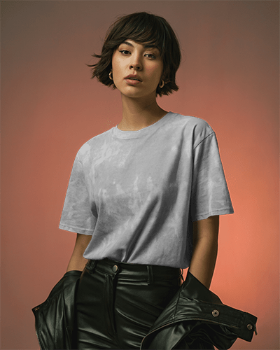 Editorial Style T Shirt Mockup Confident Woman Posing With Jacket Under Arm In Moody Lighting