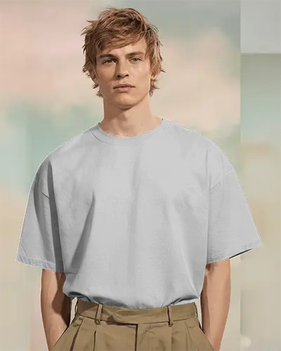 Boxy White Tshirt Mockup Male Model Standing In Soft Pastel Studio Lighting