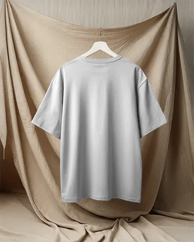 Boxy Blank White Round Neck Unisex T Shirt Mockup Back View On Hanger Draped Fabric Backdrop Soft Neutral Lighting Minimal And Elegant Presentation