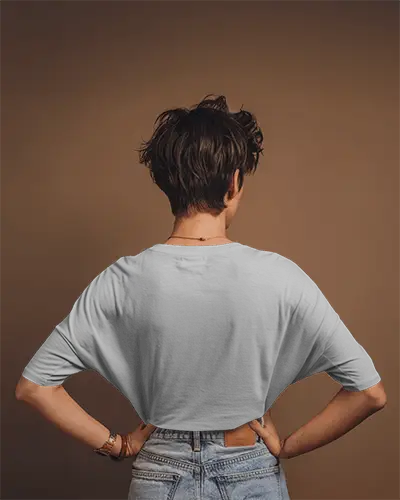 Studio Lit Round Neck Blank White Oversized T Shirt Mockup Women Model Back View