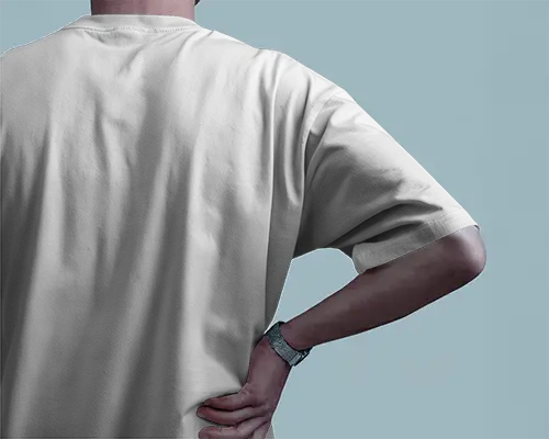 Back View Round Neck Blank White Oversized T Shirt Mockup Male Model With Hand On Hip