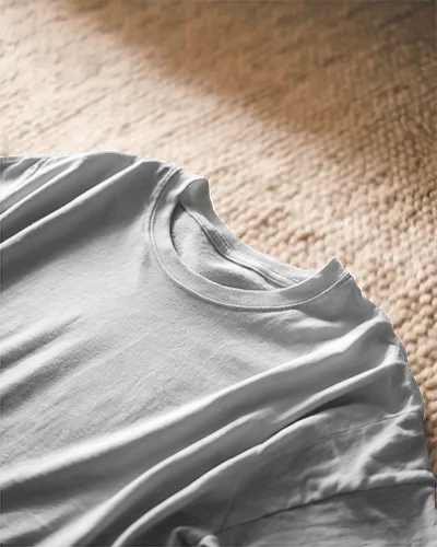 Close Up Blank White Round Neck T Shirt Mockup On Warm Textured Carpet