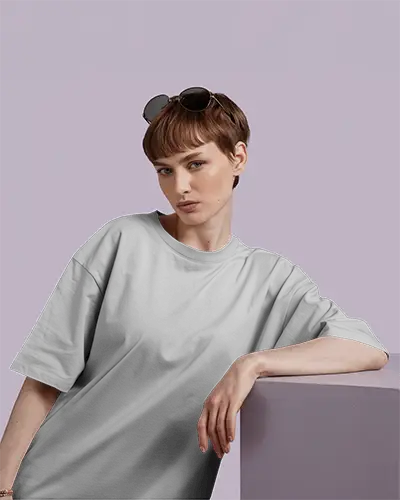 Oversized White Tshirt Mockup Female Model Short Hair Sunglasses On Head Leaning On Purple Block