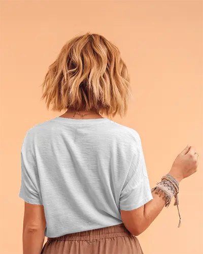 Back View Tshirt Mockup Female Model With Wavy Blonde Hair On Peach Background