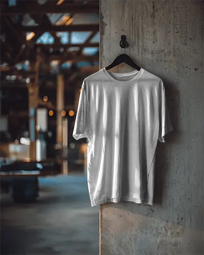 Hanging Tshirt Mockup On Concrete Wall In Industrial Loft Setting
