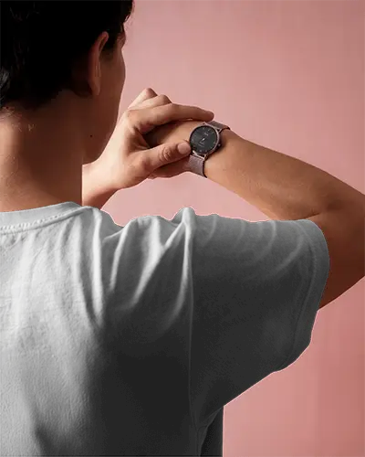 Closeup Tshirt Sleeve Mockup Person Checking Watch On Pink Studio Background