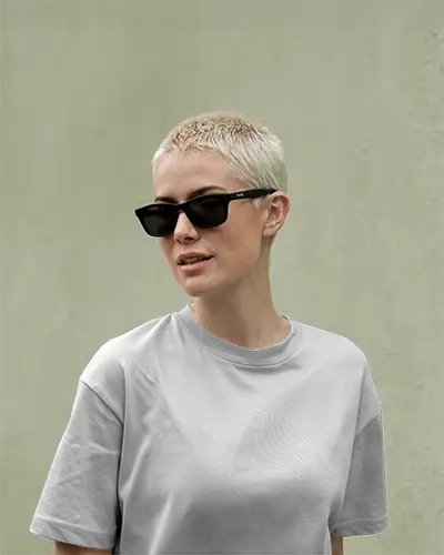Modern Urban Tshirt Mockup Female Model In Gray Tee Against Muted Wall