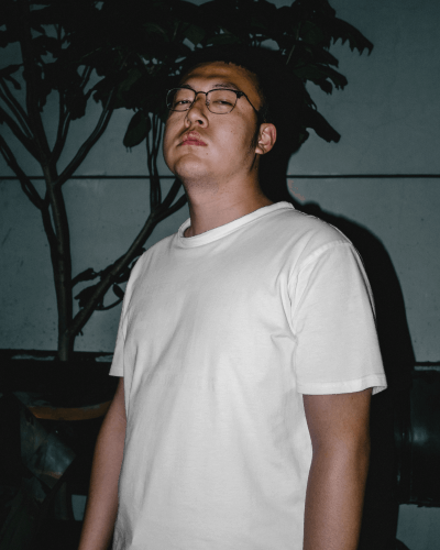 Asian Man Tshirt Mockup In Dark