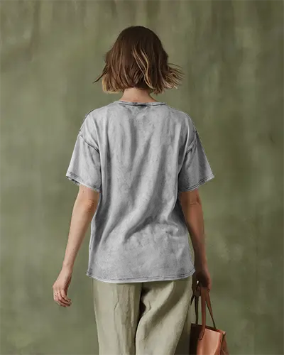 Vintage Style Acid Wash Tee Mockup Woman In Relaxed Fit Against Earthy Background