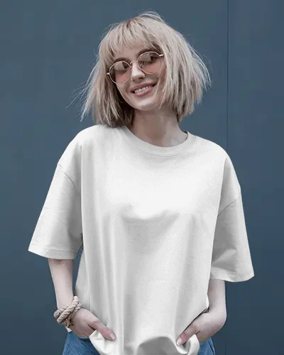 Stylish Woman Showcasing T Shirt Against A Sophisticated Blue Wall