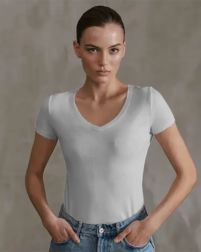 Studio T Shirt Mockup Female Model In V Neck White Tee With Hands In Pockets Minimal Background And Confident Pose
