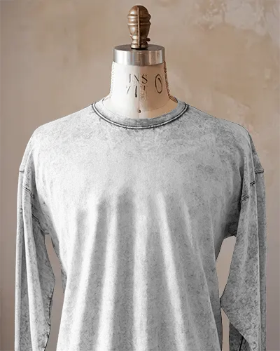 Realistic Long Sleeve Tshirt Mockup On Tailor Mannequin Against Textured Wall For Minimalist Branding