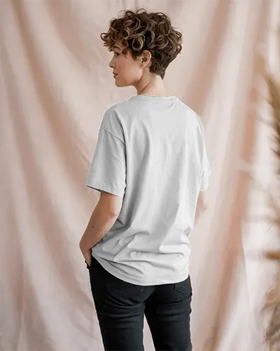 Pastel Backdrop T Shirt Mockup Female Model Facing Away Hands In Pockets Relaxed Pose Soft Diffused Lighting Casual Vibe 01247