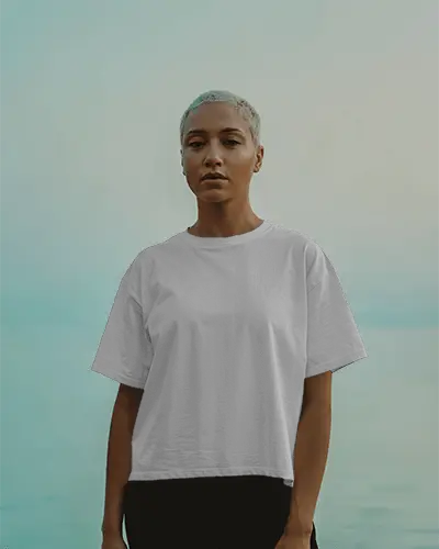 Soft Outdoor Lighting Tshirt Mockup With Strong Female Figure In Clean Crop Top And Muted Waterscape