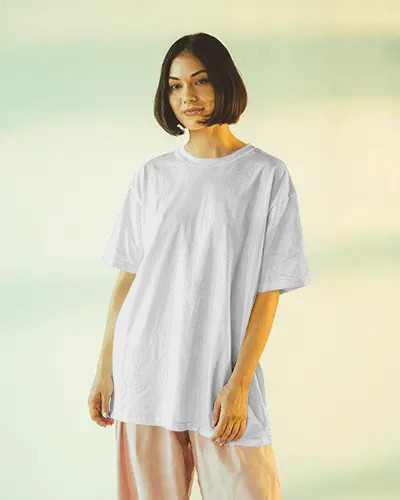 High Fashion Inspired Tshirt Mockup In Soft Studio Light On Model With Natural Expression And Flowy Outfit