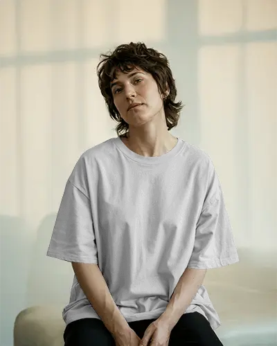 Natural Light T Shirt Mockup Casual Female Model In Relaxed Fit Tee And Modern Setting