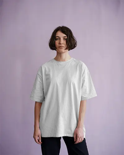 Pastel Backdrop T Shirt Mockup Female Model In Tee Standing In Soft Purple Studio