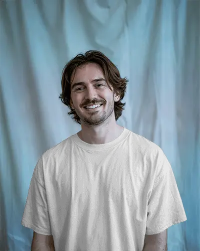 Smiling Man Tshirt Mockup Front View Light Gradient Curtain Soft Lighting