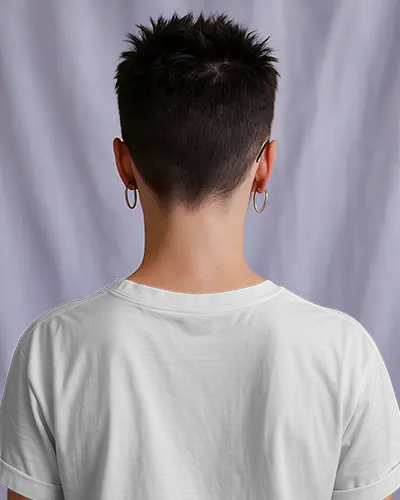 White Crew Neck T Shirt Mockup Back View On Person With Short Spiky Hair And Hoop Earrings Soft Purple Backdrop Clean And Modern Presentation
