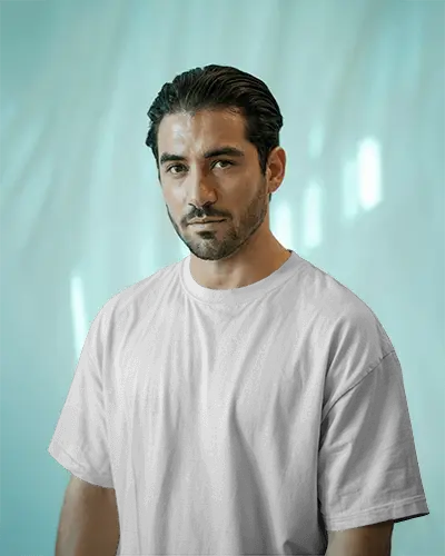 Soft Gradient Backdrop T Shirt Mockup Male Model Staring Confidently In Natural Light