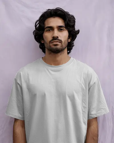 Studio Portrait T Shirt Mockup Male Model In White Oversized Tee Light Purple Textured Backdrop Minimalist Casual Fashion Style