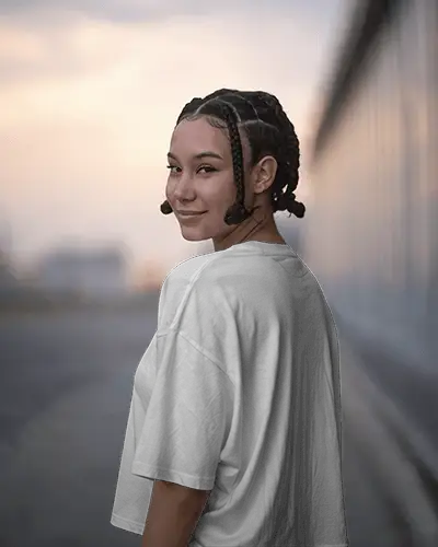 Urban Sunset T Shirt Mockup Female Model In White Oversized Tee Back View Smiling Soft Evening Light Streetwear Casual Fashion