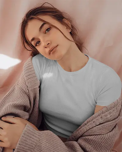 Cozy Tshirt Mockup Female Model Reclining Against Soft Pink Fabric In Knit Cardigan Relaxed Intimate Lighting And Warm Vibe