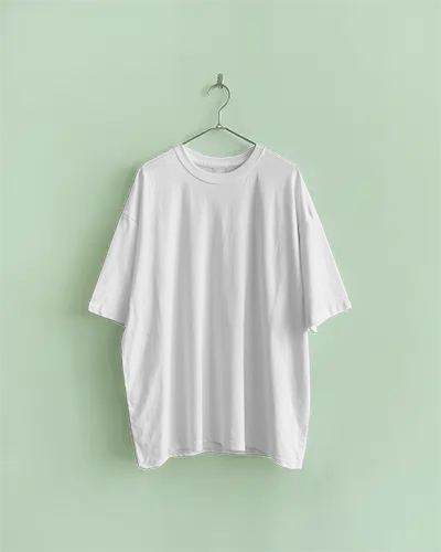 Boxy Tshirt Mockup Hanging White Tee On Pastel Green Wall Minimal Front View With Natural Lighting And Clean Modern Aesthetic
