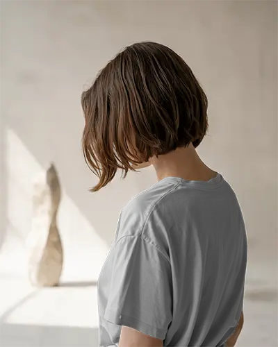 Back View T Shirt Mockup Female Model In White Tee Under Natural Studio Light