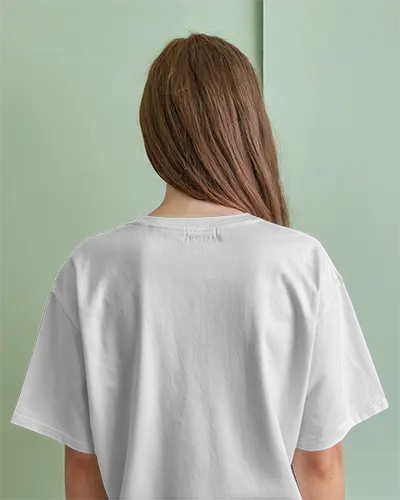Back View Tshirt Mockup Female Model In White Shirt Against Pastel Green Wall