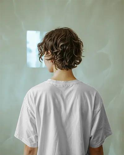 Back View Tshirt Mockup Curly Haired Model In White Shirt With Soft Mint Wall