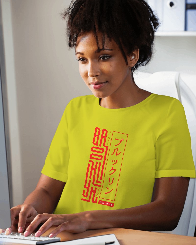 Woman Tshirt Mockup Working On Computer