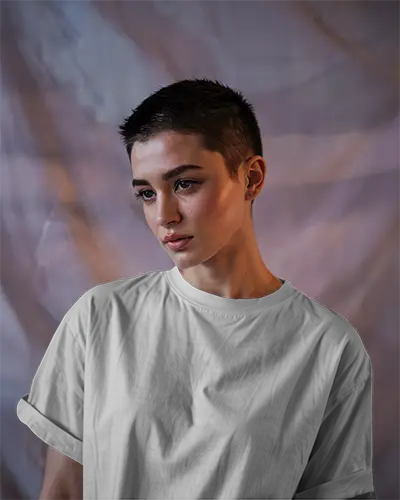 Front View Tshirt Mockup Female Model With Buzzcut Moody Studio Lighting Soft Purple Backdrop