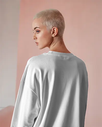 Minimalist Long Sleeve White Tshirt Mockup Buzzcut Female Model In Soft Pink Backdrop Modern Fashion Brand Template With Elegant Posture