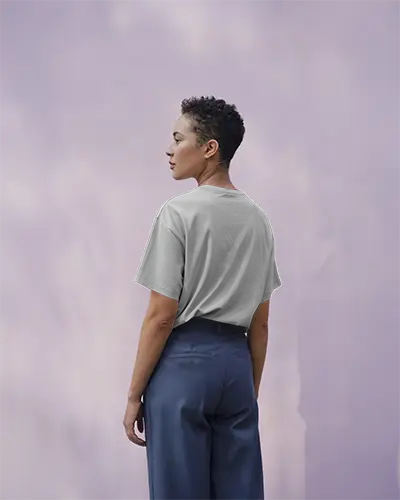 Back View White Tshirt Mockup Model In Blue Pants Soft Purple Sky Background Minimalist Style For Custom Design Display And Brand Showcase