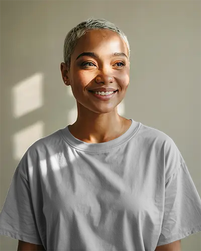 Smiling Woman White Tshirt Mockup Front View Soft Sunlight Through Window Shadows On Beige Wall Clean Minimal Design Template For Fresh Branding