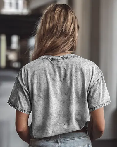 Acid Wash Tshirt Mockup Back View Female Model Wearing Faded Grey Tee In Urban Setting Soft Lighting Perfect For Retro Streetwear Branding