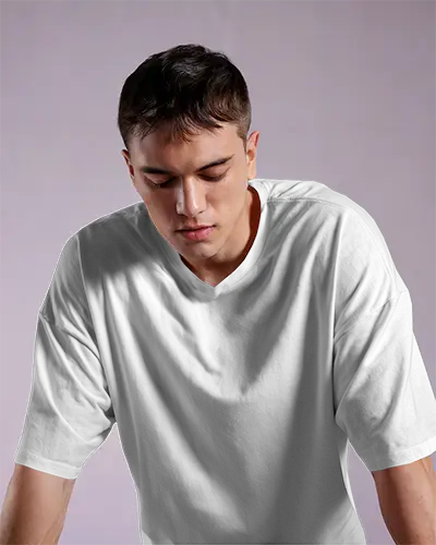 Moody Closeup White Tshirt Mockup Male Model Looking Down In Soft Purple Lighting Modern Streetwear Design Showcase Urban Menswear Focus
